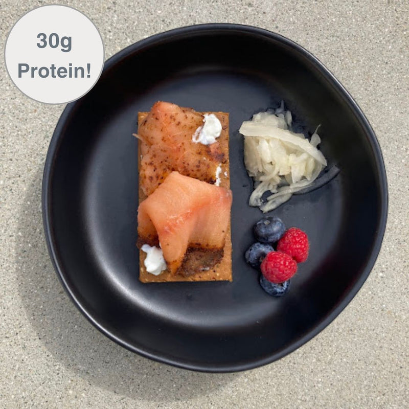 Fello Everything Bagel Bar topped with greek yogurt and smoked salmon served with berries and veggies. 30g protein per serving.