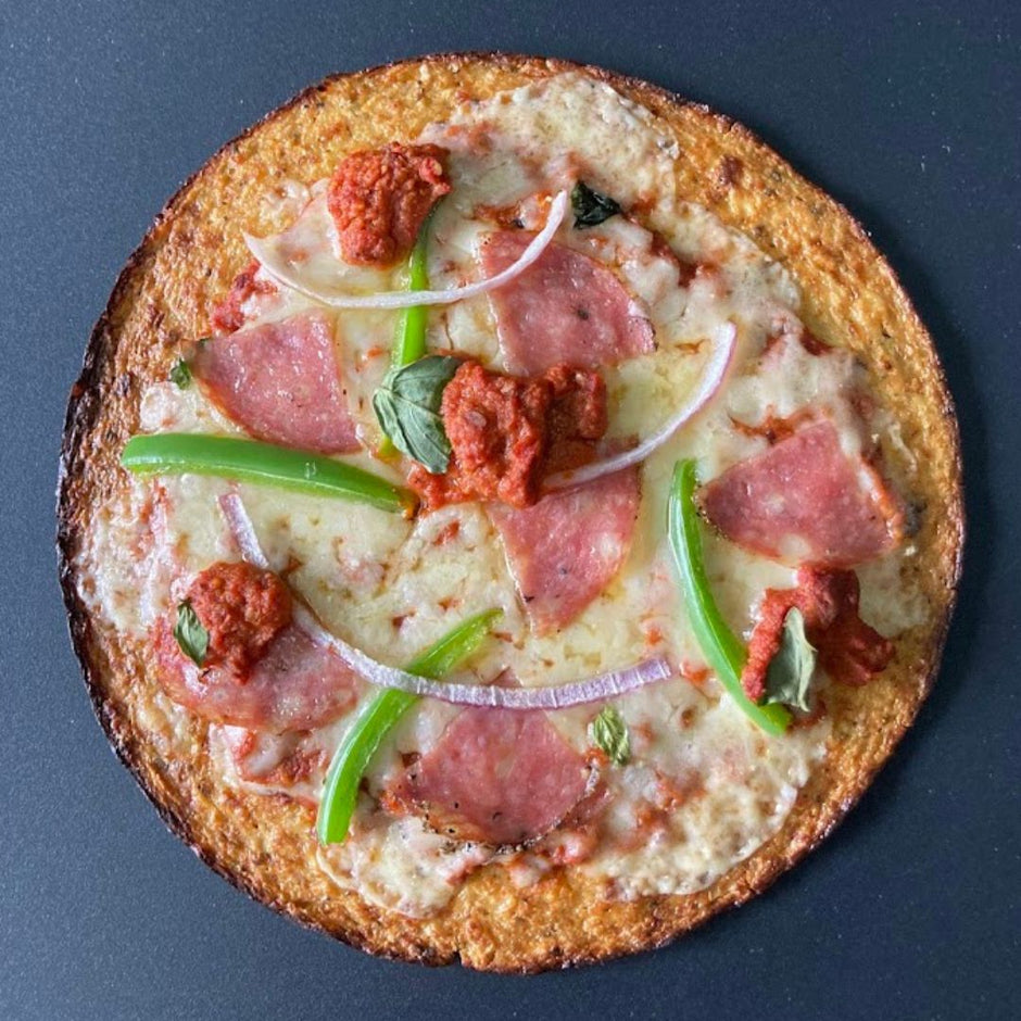 Pizza with veggies, cheese, and meat topped with Fello protein tomato sauce.