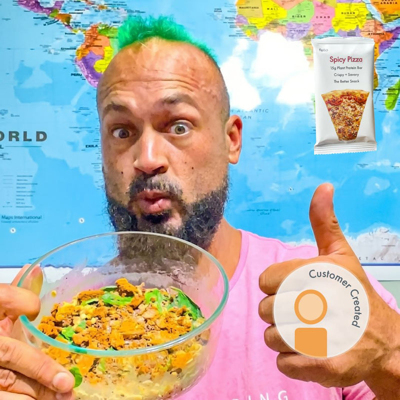 Man Holding Bowl of savory oats topped with Fello Spicy Pizza protein bar.