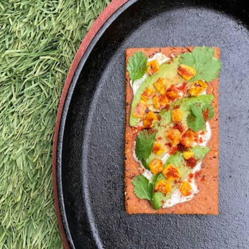 Fello Zesty BBQ Bar topped with greek yogurt, avocado, corn, cilantro, and chili powder.